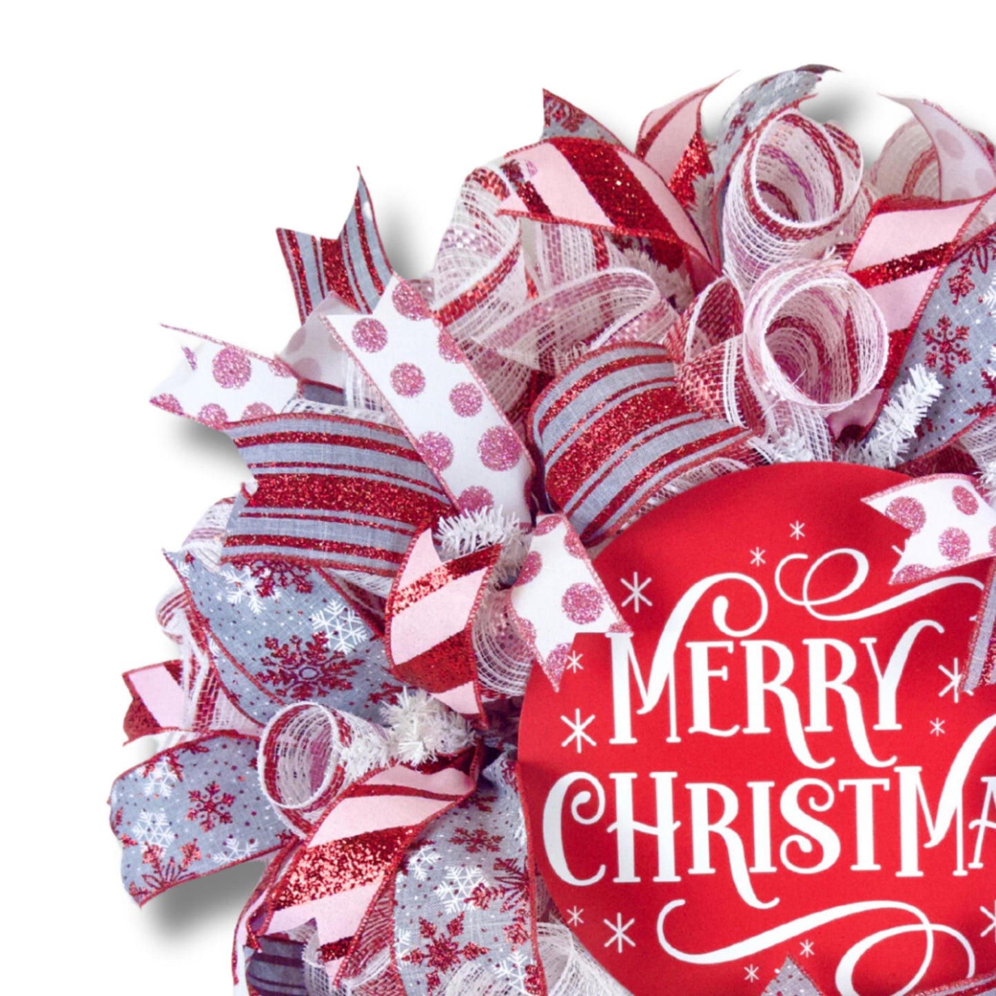 Red and white holiday wreath with layered ribbons and snowflake accents for front door display