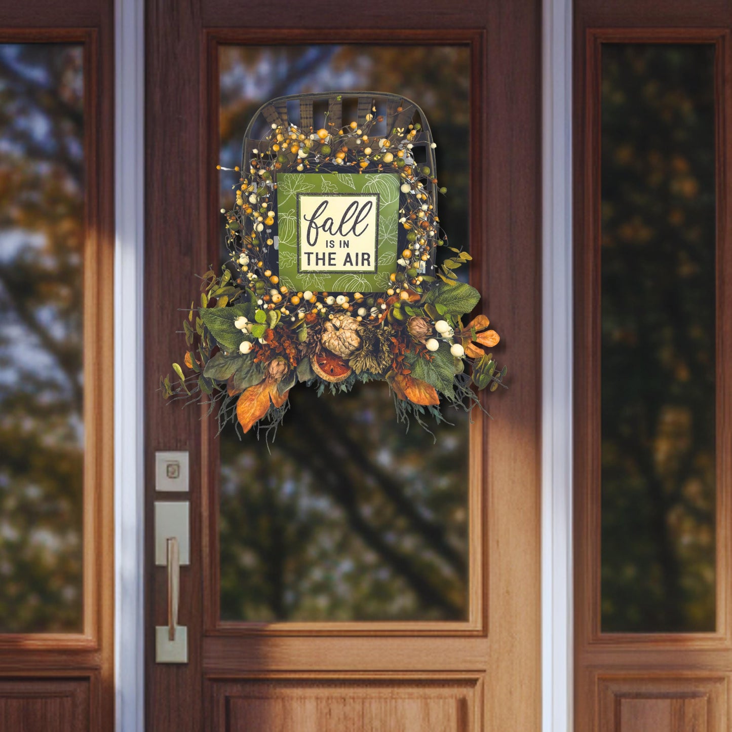 Autumn front door wreath with faux berries and fall sign on modern farmhouse entrance