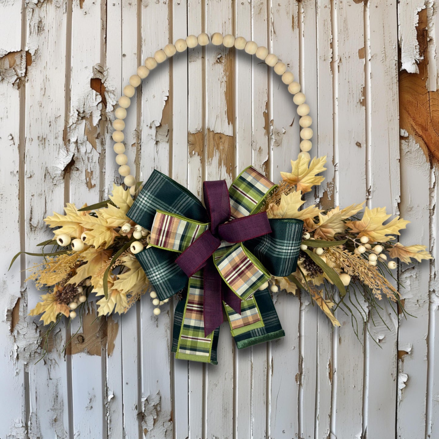 Overhead view of beaded hoop wreath showing all design elements including plaid bow, faux wheat, berries, and maple leaves.