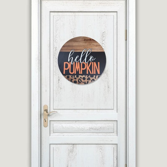 Stylish "Hello Pumpkin" door sign displayed on a white door, showcasing its vibrant fall colors and leopard print accents for modern farmhouse decor.