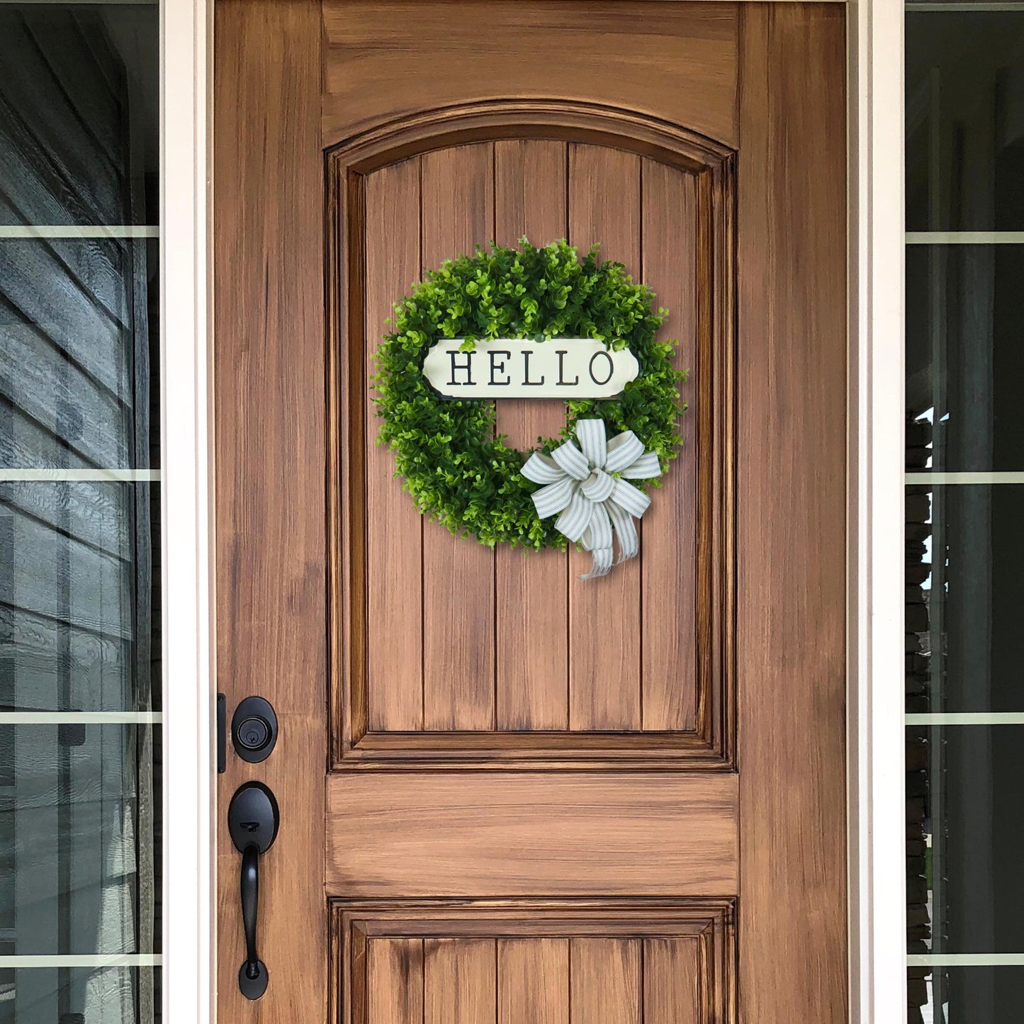 Rustic boxwood door wreath with metal hello sign and striped bow, spring and summer front door decoration, farmhouse greenery wreath.