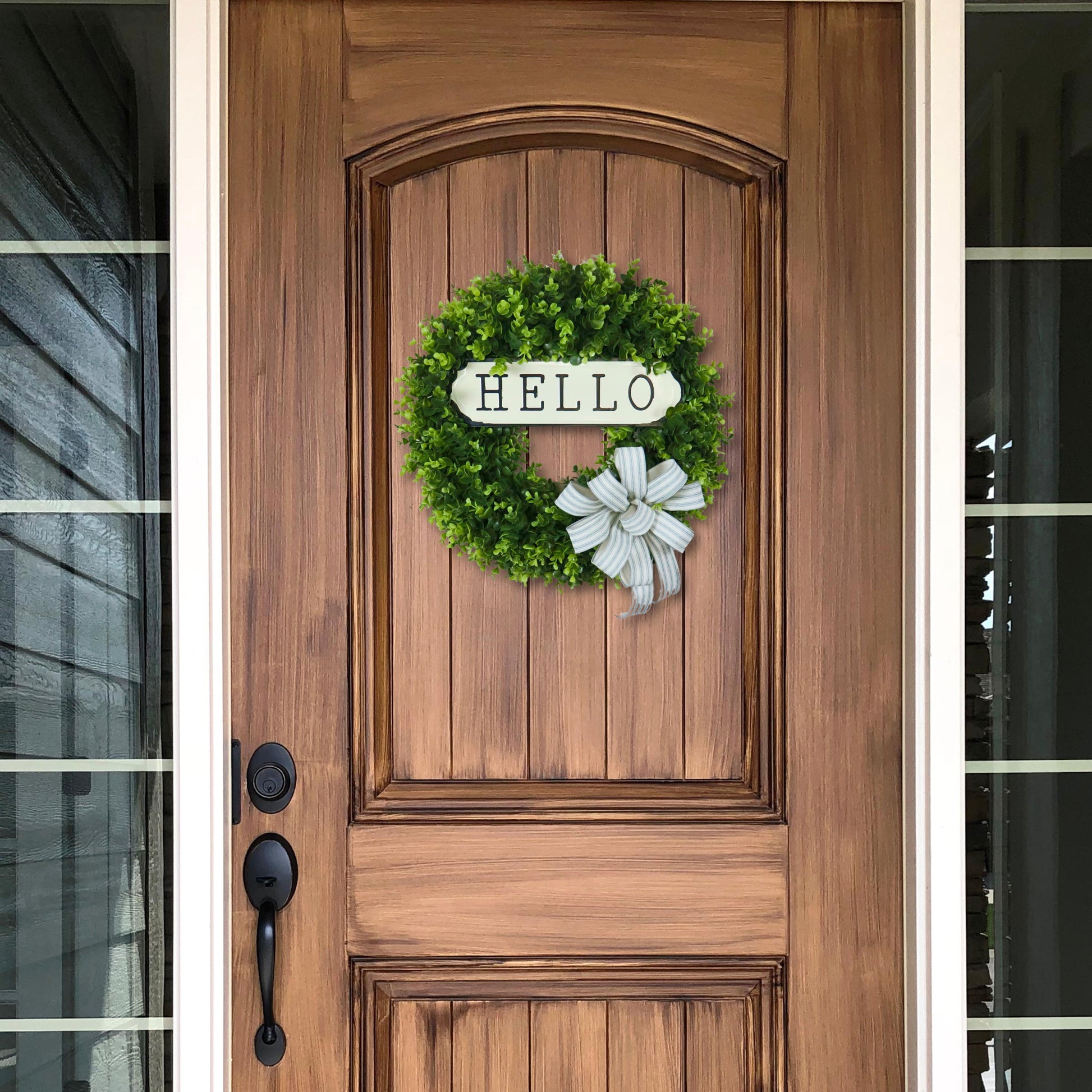 Rustic boxwood door wreath with metal hello sign and striped bow, spring and summer front door decoration, farmhouse greenery wreath.