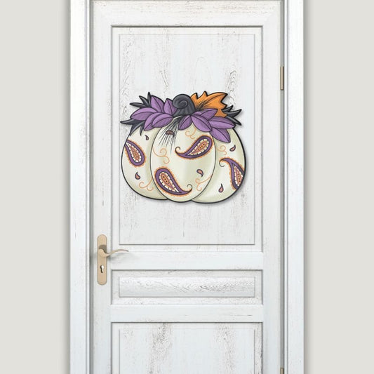 Paisley Pumpkin Door Hanger displayed on a white door, adding a stylish and festive fall accent to your home.