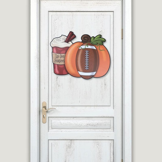 Decorative Pumpkin Football Wood Door Hanger displayed on a white farmhouse-style door. Ideal for welcoming fall guests with a cozy sports and seasonal theme.